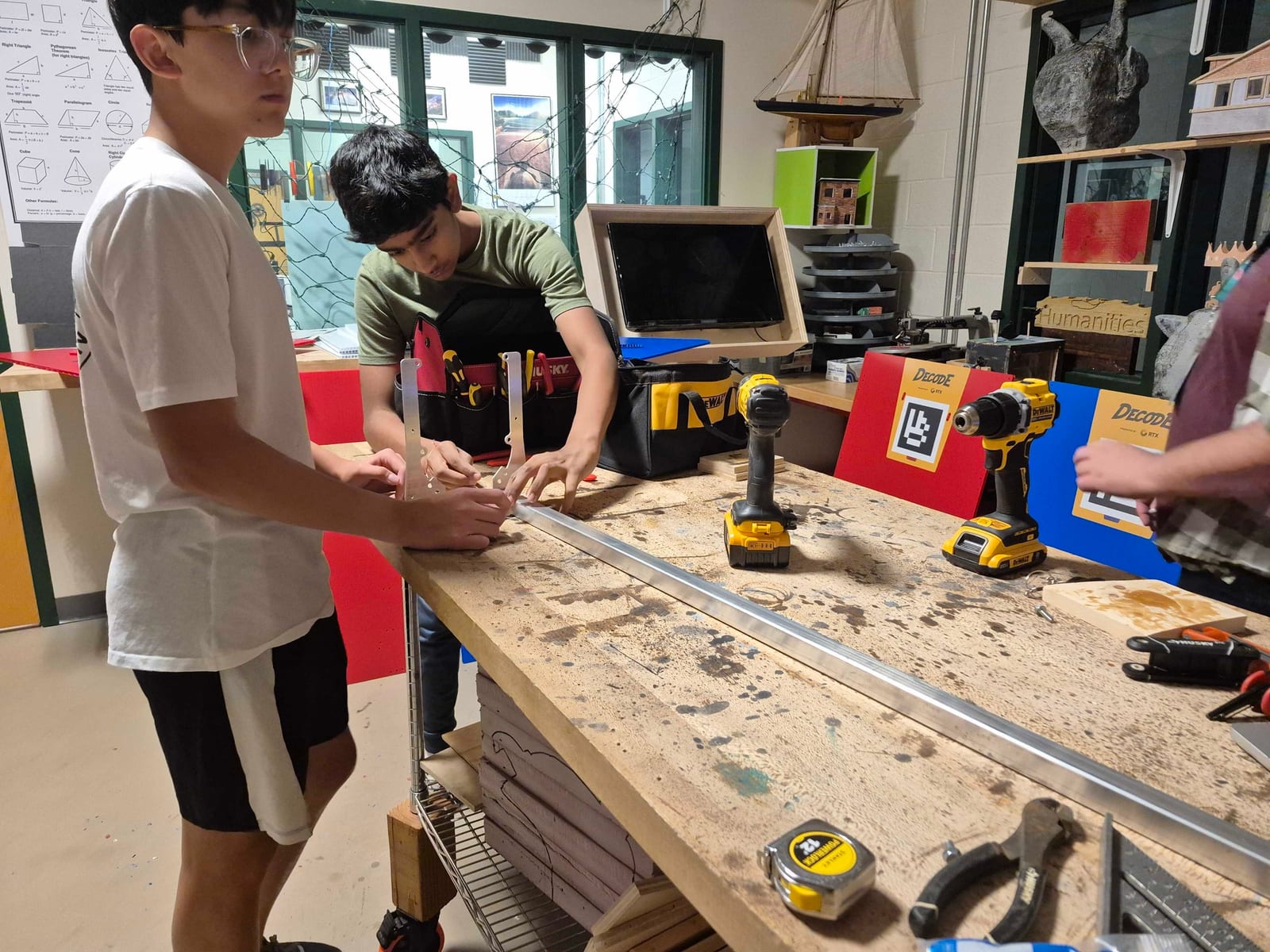 Students building a wooden goal ramp