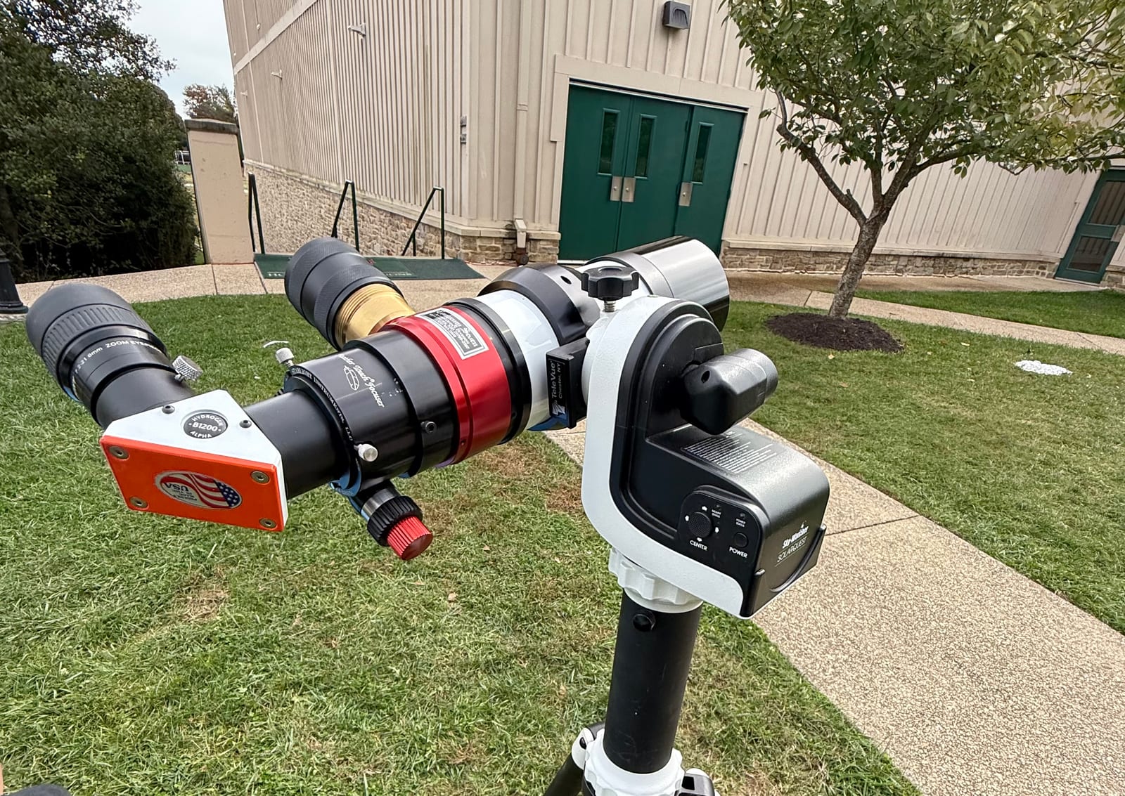 A solar telescope on a tripod on the lawn